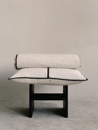 ferm LIVING Vari quilted bedspread dressed on a bed in a calm interior