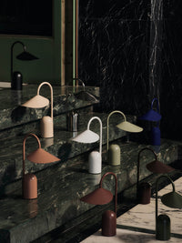 Detail of the Arum portable lamp's shade and stem in cashmere