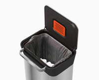 Close-up of the Titan compaction handle pressing waste down