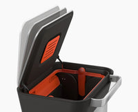 Titan 30L trash compactor beside kitchen cabinetry