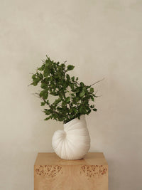 ferm LIVING Shell vase styled with flowers in an interior setting