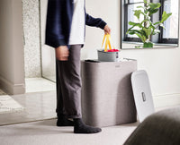 Tota Trio grey laundry basket with lid on, front view