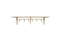 Nkuku Basti antique brass iron storage shelf with six hooks on white background