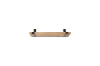 Angled view of the Ibo small shelf with antique brass brackets