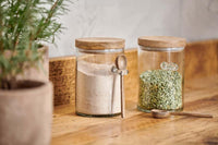 Kossi jars with wooden spoons styled on a pantry shelf