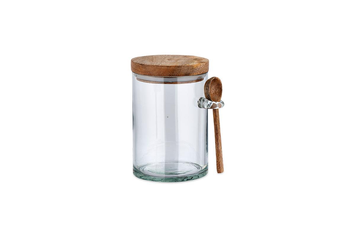 Nkuku Kossi large recycled glass storage jar with mango wood lid and wooden spoon on white background