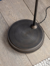 Detail of the Hoxton floor lamp glass dome shade and bronze stem