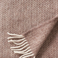 Close-up of the sand diamond weave and fringe of the Klippan Lima throw