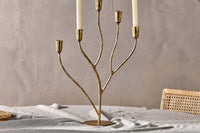 Close view of the Palani candelabra's branching antique brass arms