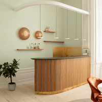 UMAGE Asteria Micro pearl white pendants styled with oak wall lamps