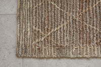 Close-up of the Vandi doormat's woven diamond texture