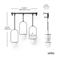 Umbra Triflora hanging planter set styled in a living space with houseplants
