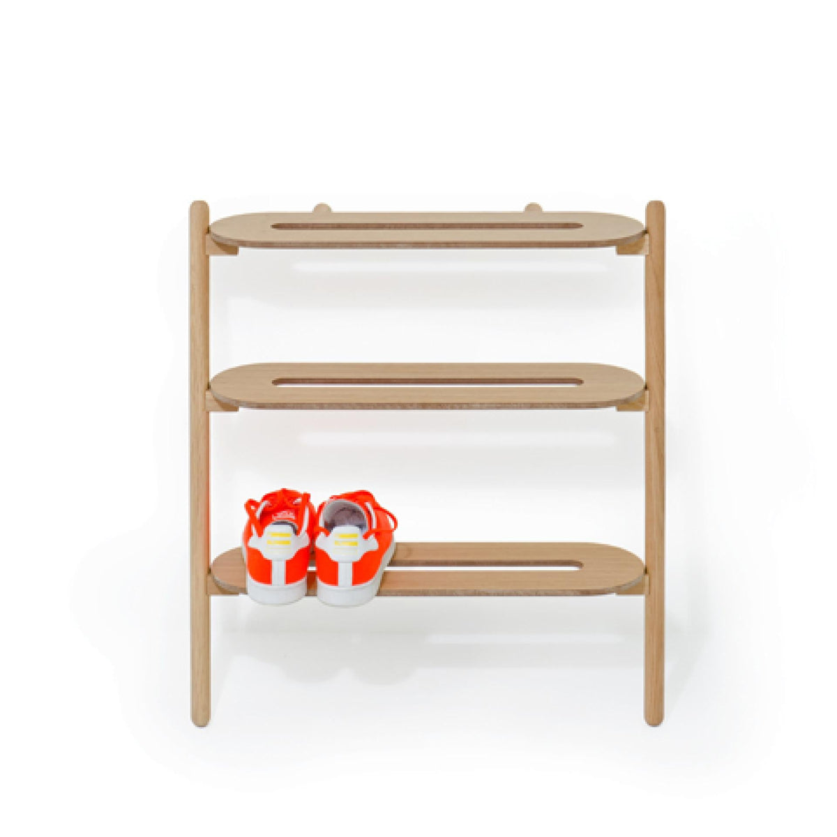 Wireworks Heel Bar oak leaning shoe rack with a pair of trainers on the bottom shelf