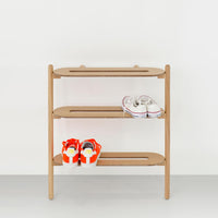 Side view of the Wireworks Heel Bar showing its leaning oak frame